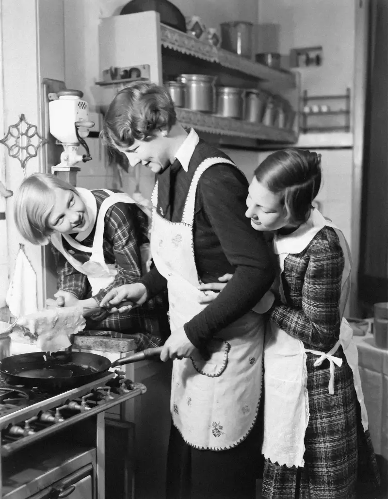 Family cooking together in kitchen